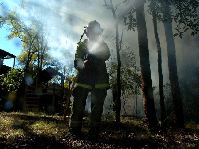 An RFS fire fighter controls a pile burn in bushland. Picture: Mat Sullivan