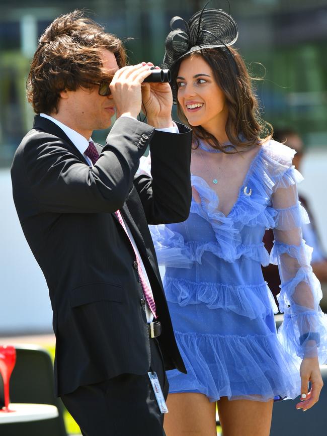 Punters watch on as Race 2 is run. Picture: Vince Caligiuri