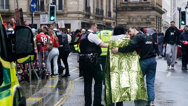 Police and emergency personnel with victims of the incident. Picture: AP