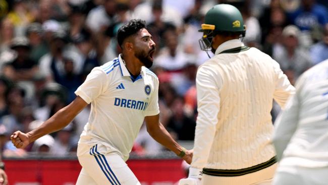 Indian bowler Mohammed Siraj celebrates with teammates after dismissing Australian batsman Usman Khawaja (R) on the fourth day of the fourth cricket Test match between Australia and India at the Melbourne Cricket Ground (MCG) in Melbourne on December 29, 2024. (Photo by William WEST / AFP) / -- IMAGE RESTRICTED TO EDITORIAL USE - STRICTLY NO COMMERCIAL USE --