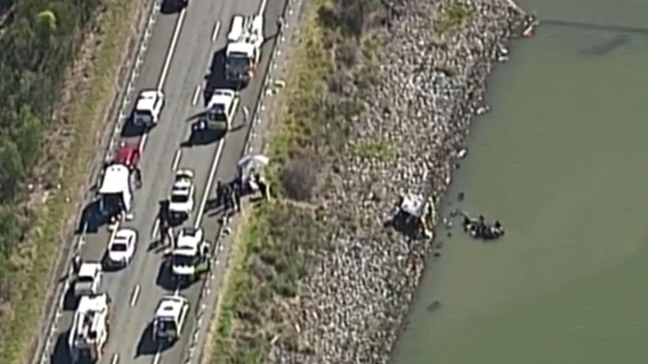 Channel 7 screen grabs of the accident on Boonah and Beaudesert Road where the family’s car plunged into the Wyaralong Dam. Picture: Channel 7