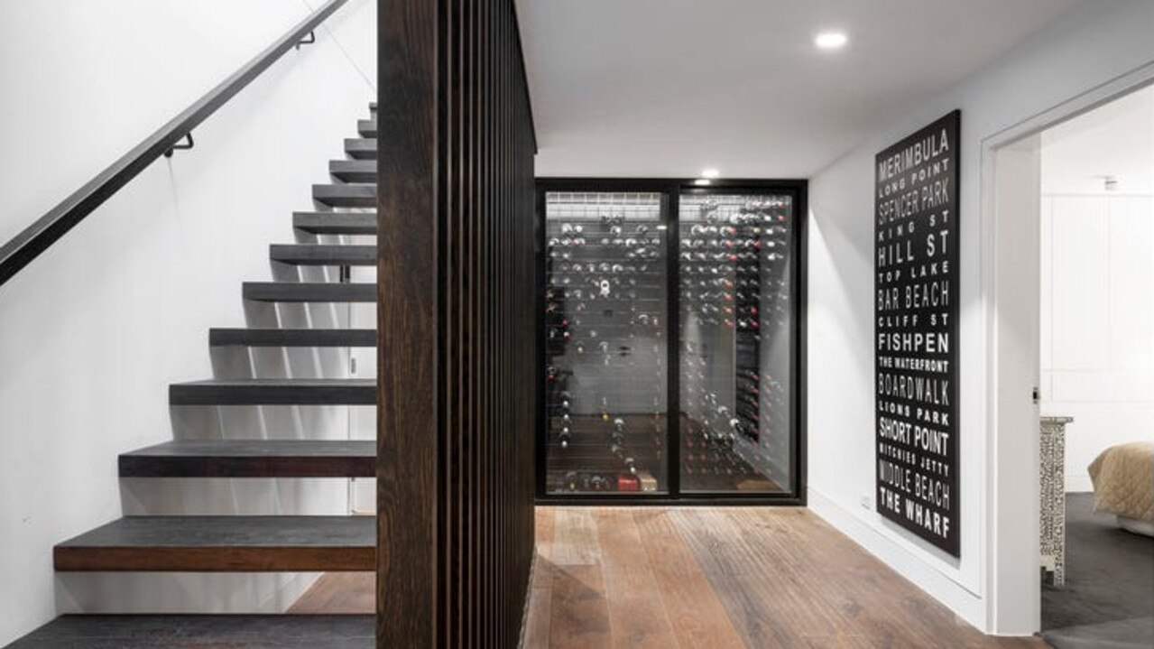 The basement features a wine display cabinet.