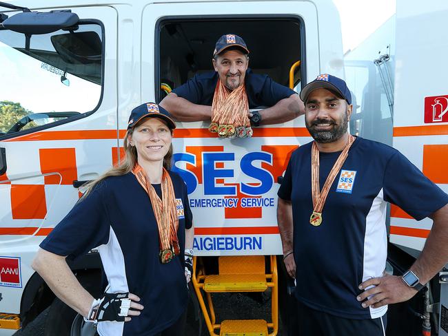 Craigieburn SES members Anita Lutz , Rob Reid and Harminder Singh have just competed in the Victorian Police and Emergency Service Games. With 17 medals gained between them it's no wonder they are all smiles. Picture : Ian Currie