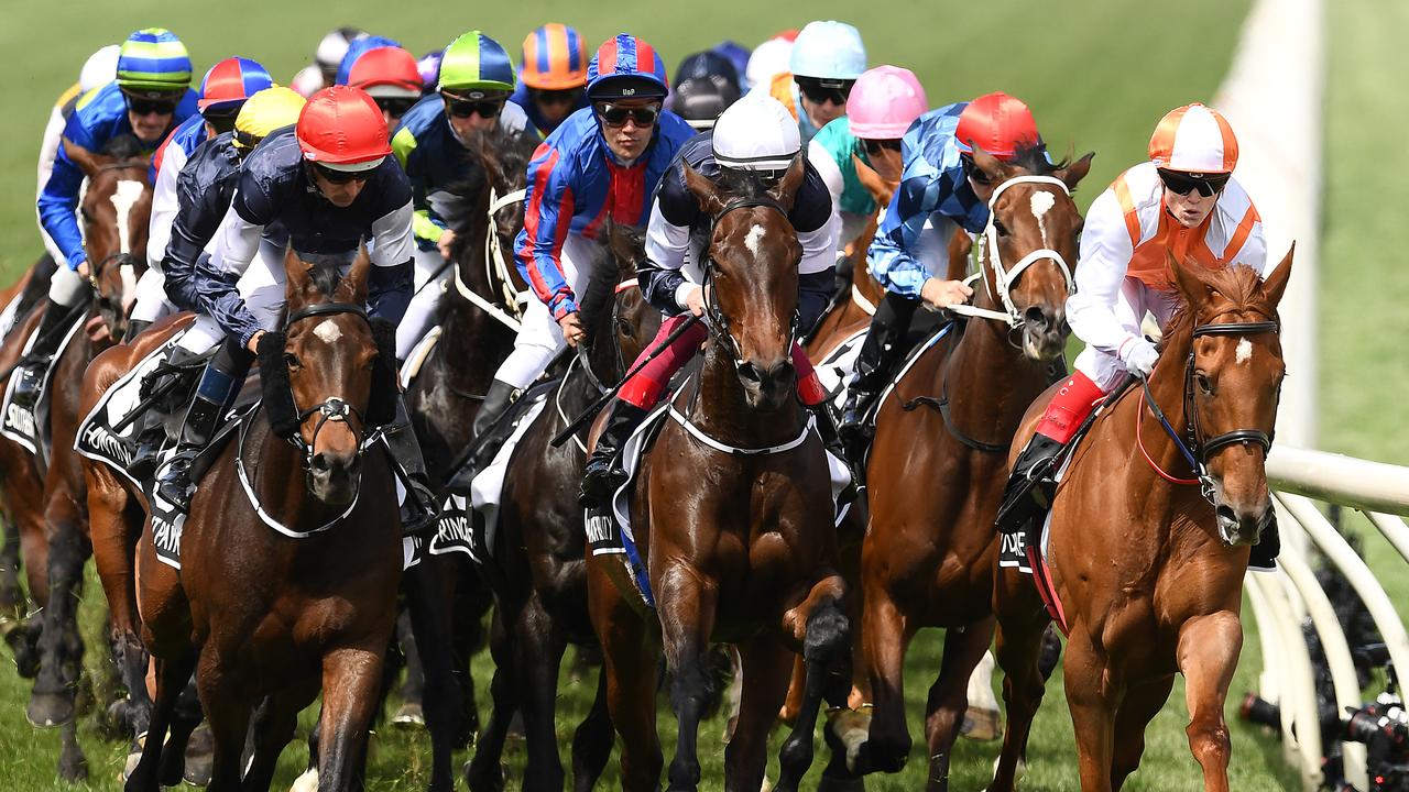 MELBOURNE, AUSTRALIA - NOVEMBER 05: Craig Williams riding Vow and Declare leads the field around the first bend in the Lexus Melbourne Cup during 2019 Melbourne Cup Day at Flemington Racecourse on November 05, 2019 in Melbourne, Australia. (Photo by Quinn Rooney/Getty Images) *** BESTPIX ***