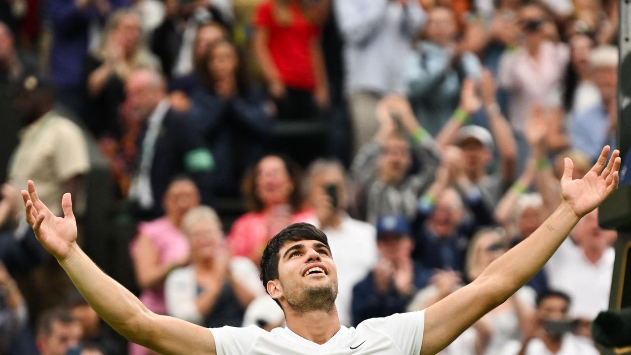 TOPSHOT - Spain's Carlos Alcaraz celebrates mimic Jude Bellingham’s celebration after winning a five-set thriller at Wimbledon.