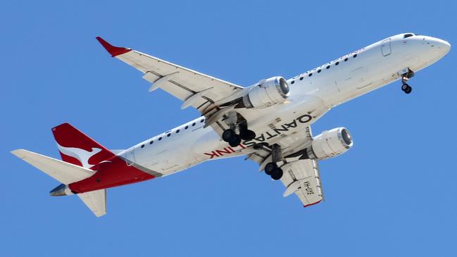 BRISBANE, AUSTRALIA - NewsWire Photos SEPTEMBER 30, 2024: A Qantas plane prepares to land in Brisbane. Hundreds of Qantas workers went on strike today demanding higher wages. Picture: NewsWire/Tertius Pickard