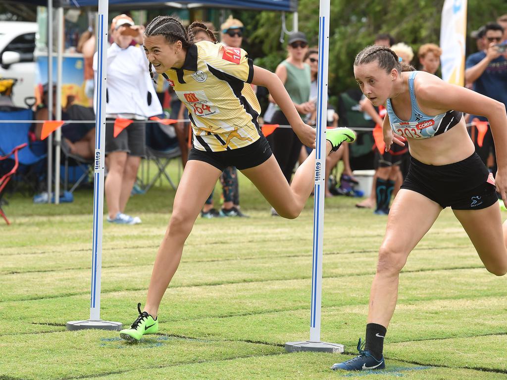 South Coast Little Athletics Titles at Pizzey Park in Miami. Girls 100 metre 14 yrs. Amali Butcher (on right) just beats Dior Scholz over the line. Picture: Lawrence Pinder