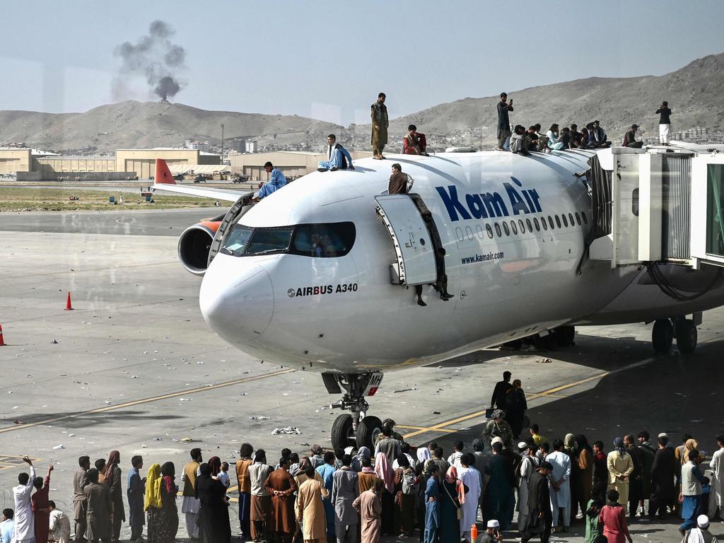 Hundreds of Afghans fled to the airport. Picture: Wakil Kohsar/AFP