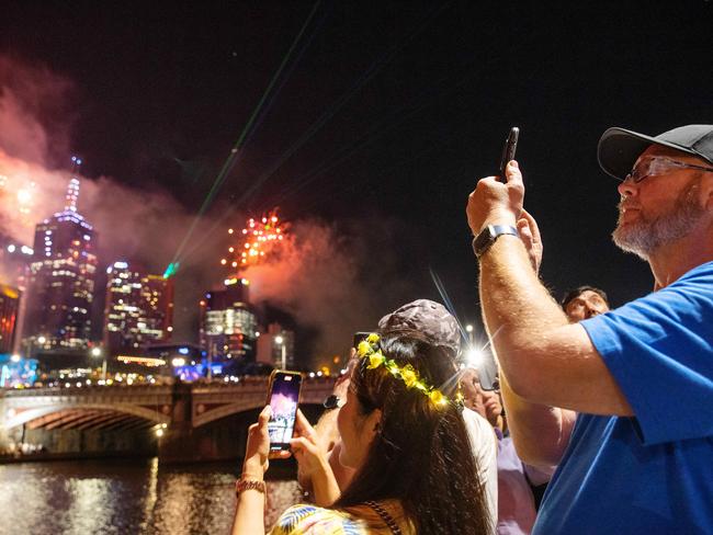 Is it even New Year’s Eve if you don’t document it for social media? Picture: Mark Stewart