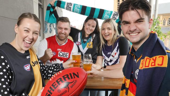 Kym Bond, (Sydney), Lauren Bond, (Freemantle), Georgie Orchard, (Port Power), Jack Trim, (Crows), and Holly Payne (Richmond) at the Cathedral Hotel ahead of AFL Gather Round. Picture Dean Martin