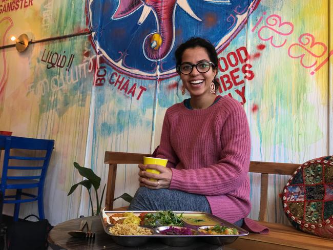 Nalini's co-owner Vidya Raman with the 6 Tastes Ayurvedic Thali, and a turmeric latte. Picture: Jenifer Jagielski