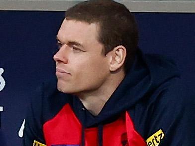 MELBOURNE, AUSTRALIA - APRIL 02: Ben Brown of the Demons looks on from the bench after being subbed out of the match with a back injury during the 2023 AFL Round 03 match between the Melbourne Demons and the Sydney Swans at the Melbourne Cricket Ground on April 2, 2023 in Melbourne, Australia. (Photo by Michael Willson/AFL Photos via Getty Images)