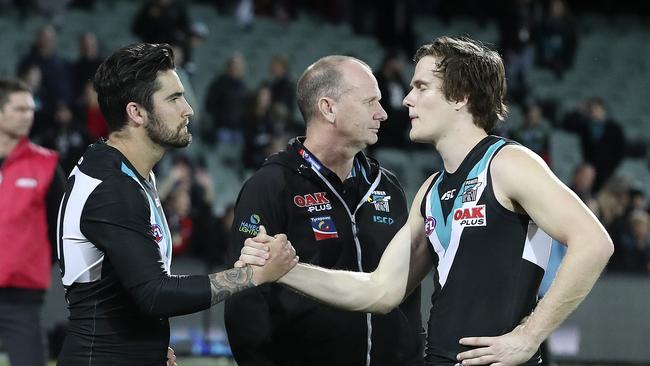 Chad Wingard with Jared Polec and coach Ken Hinkley after their last game for the Power last year. Picture SARAH REED