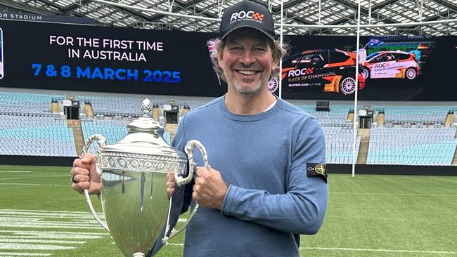 Race of Champions president and co-founder Fredrik Johnsson with the ROC trophy at Accor Stadium.