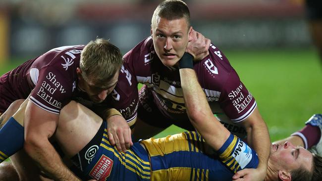 SYDNEY, AUSTRALIA - JULY 18: Nathan Brown of the Eels is tackled by Sean Keppie of the Sea Eagles during the round 10 NRL match between the Manly Sea Eagles and the Parramatta Eels at Lottoland on July 18, 2020 in Sydney, Australia. (Photo by Jason McCawley/Getty Images)