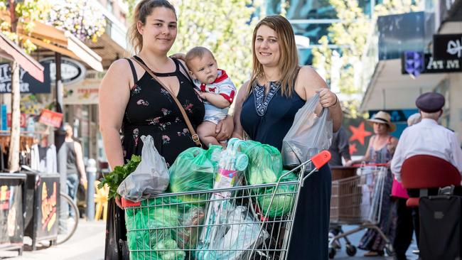 Renee Hampton — with her son, Sebastian, 8 months and sister, Nicole Hampton — says she likes the convenience of plastic bags. Picture: Jake Nowakowski