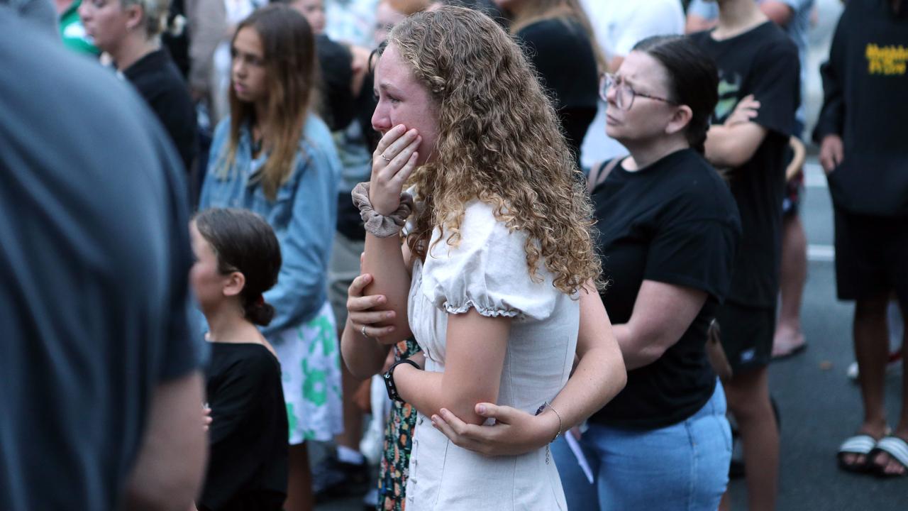 A school friend mourns at a candlelight vigil Tweed Heads Public School. Picture: NCA NewsWire / Richard Gosling