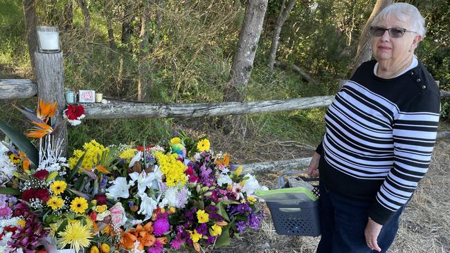 Coffs resident Noreen Savige at the site of the fatal stabbing of Kye Schaefer – where floral and other tributes have piled high. Picture: Janine Watson