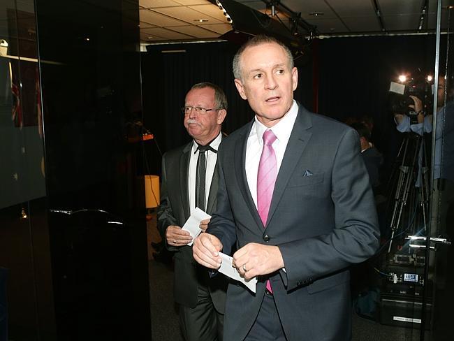 Independent MP Geoff Brock and Premier Jay Weatherill head to a press conference at the State Administration Centre. Picture: Calum Robertson