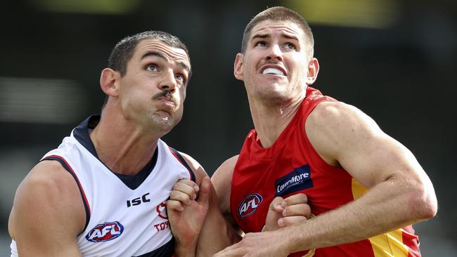 Taylor Walker contests the boundary throw-in with Zac Smith. Picture: Sarah Reed