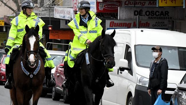 Lockdown enforcement: mounted police made a brief appearance around lunchtime along Chapel St, Bankstown, in Sydney’s southwest. Picture: Matrix