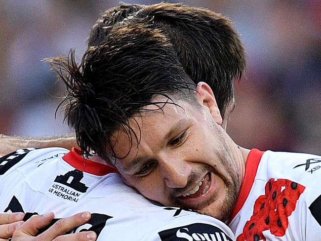 Ben Hunt of the Dragons (left) celebrates with Gareth Widdop after scoring a try during the Round 8 NRL match between the St George Illawarra Dragons and the Sydney Rooster at Allianz Stadium in Sydney, Wednesday, April 25, 2018. (AAP Image/Dan Himbrechts) NO ARCHIVING, EDITORIAL USE ONLY