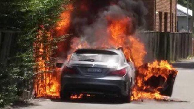 A car on fire in Chandler St, Kogarah, believed to be involved in the Mick Hawi shooting. Picture: Claude Nunes