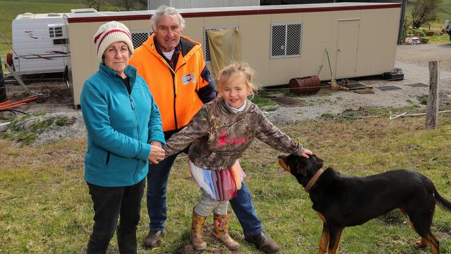 Jeff McCole with his wife Margie and their granddaughter Emily, and their current accommodation. Picture: Alex Coppel