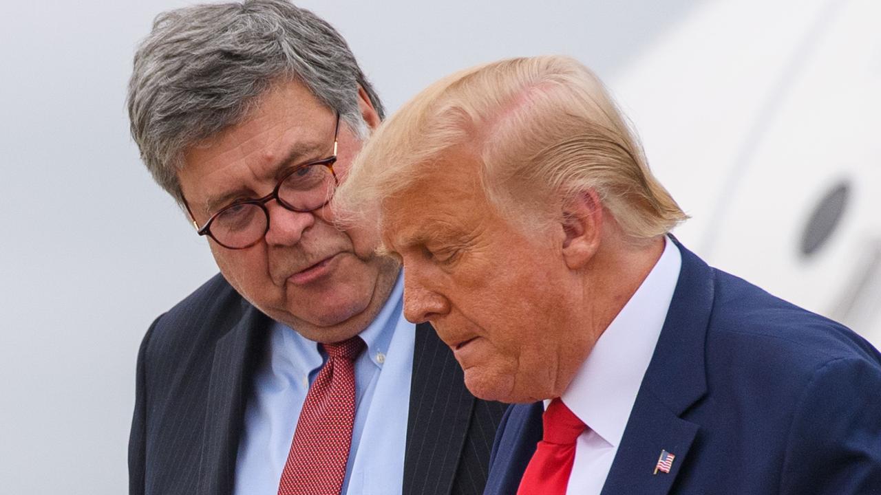 US Attorney-General William Barr (left) has protected Donald Trump from prosecutions but that ends in less than 70 days. Picture: Mandel Ngan/AFP