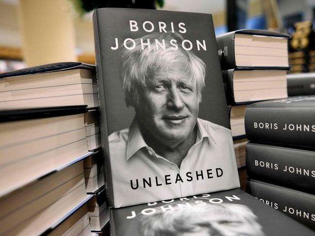 Copies of "Unleashed" by former British prime minister Boris Johnson, are displayed at Waterstones' flagship Piccadilly bookshop on the day of its release in London, on October 10, 2024. Johnson's memoir, "Unleashed", hit shelves on October 10 and charts his rise in politics,  becoming London mayor, leading the "Leave" campaign during the 2016 Brexit referendum and becoming Tory leader in 2019 when he secured a landslide general election victory. Johnson was ousted in disgrace by colleagues fewer than three years later following a series of scandals, particularly the illegal Covid lockdown-breaking parties at Downing Street. (Photo by BENJAMIN CREMEL / AFP)