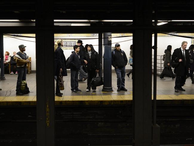 In 2012, commuters watched aghast as a man was pushed on to the tracks during a fight and hit by a train. Picture: AFP/Timothy A. Clary