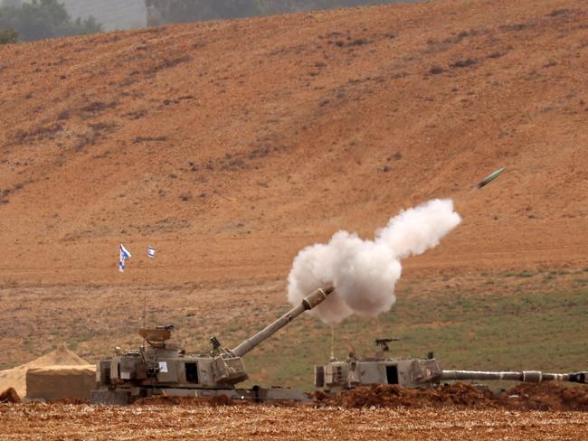 Artillery shells are fired from an undisclosed position toward the Gaza Strip by the Israeli army. Picture: AFP