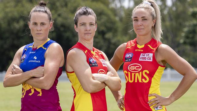 Brisbane Lions captain Emma Zielke poses with Gold Coast Co-captains Sam Virgo and Hannah Dunn. Picture: Getty Images