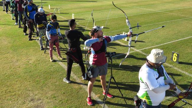 Kane Wilson (maroon) in action during his Open Male Recurve victory. Picture: VT Nguyen (Sydney Olympic Park Archery)