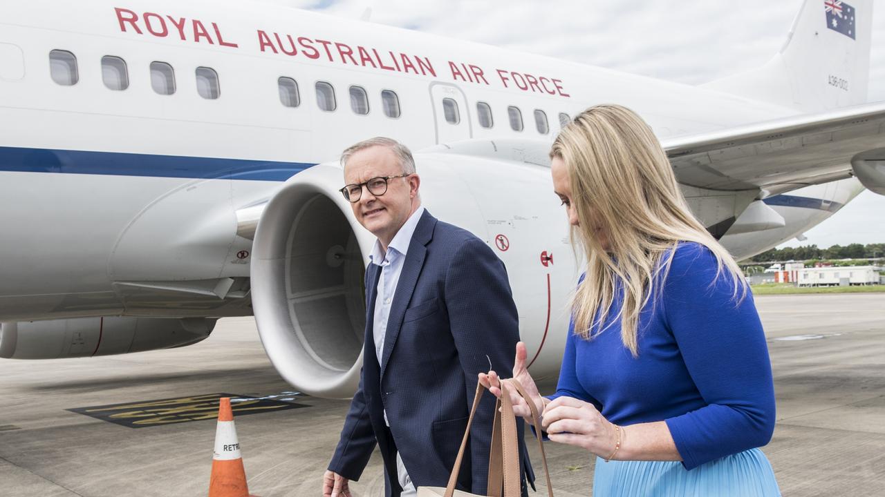 Back on the campaign trail ... Opposition Leader Anthony Albanese and his partner Jodie Haydon board a flight to Perth on Friday. Picture: Steven Siewert