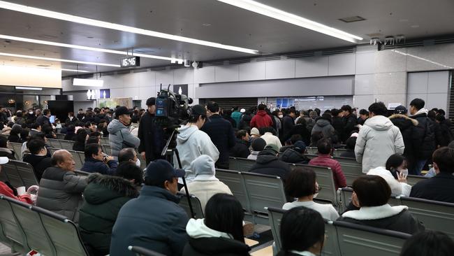 Officials are reading out the dead in a morbid kind of roll call. Picture: Chung Sung-Jun/Getty Images