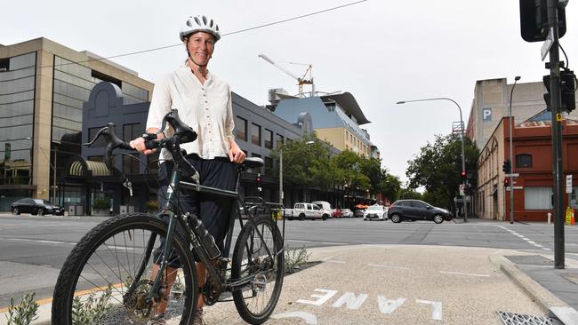 Katie Gilfillan poses at the corner of Grenfell St and Frome Rd. The institute wants the Frome St bikeway to be extended down to the River Torrens. (AAP/ Keryn Stevens)