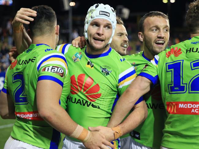 SYDNEY, AUSTRALIA - JUNE 17:  Nick Cotric of the Raiders (L) celebrates a try with Jarrod Croker and Josh Hodgson during the round 15 NRL match between the Wests Tigers and the Canberra Raiders at Campbelltown Sports Stadium on June 17, 2018 in Sydney, Australia.  (Photo by Mark Evans/Getty Images)