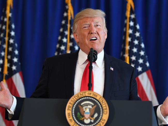 US President Donald Trump speaks to the press about protests in Charlottesville on August 12, 2017, at Trump National Golf Club in Bedminster, New Jersey. A picturesque Virginia city braced Saturday for a flood of white nationalist demonstrators as well as counter-protesters, declaring a local emergency as law enforcement attempted to quell early violent clashes.  / AFP PHOTO / JIM WATSON