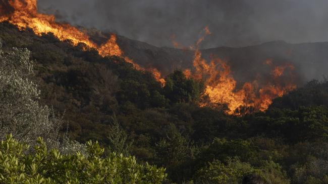 Fire on the island of Rhodes as Greece battles some 63 fires across the country during an intense heatwave. Photo by Dan Kitwood/Getty Images