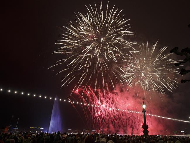 Fireworks illuminate the sky in bay next to the famous water fountain Le Jet d'Eau during New Year celebrations in Geneva, Switzerland. Picture: AP