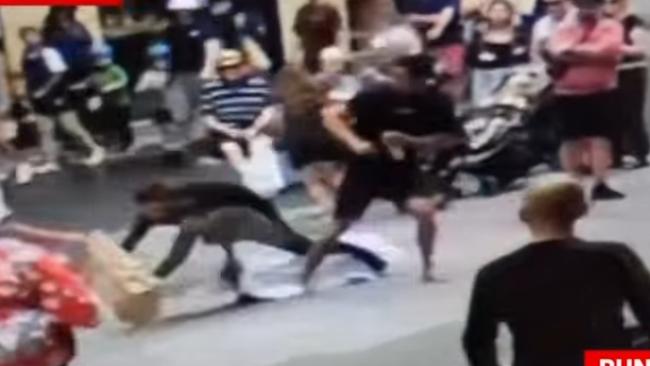 The footy-style hip-and-shoulder floored the alleged attacker. Picture: 7NEWS