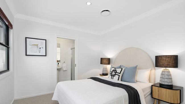 A bedroom with an ensuite at 65 Sandon Street, Graceville