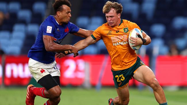 Darby Lancaster of Australia is tackled during the 2023 Sydney Sevens match between Australia and France at Allianz Stadium on January 28, 2023 in Sydney, Australia. (Photo by Mark Metcalfe/Getty Images)