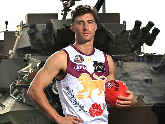 19/4/2024: Brisbane Lions defender Noah Answerth with an Army ASLAV at the Brighton Homes Arena, Springfield.  pic: Lyndon Mechielsen/Courier Mail