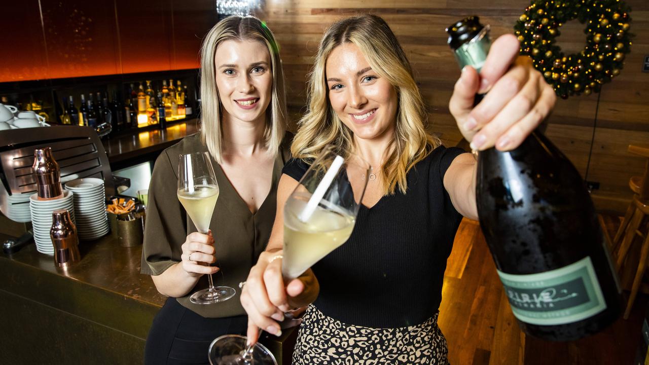 Caitlin Barnes-Whitaker and Jordyn Deamer enjoying glass of Australian sparkling at The Charming Squire, South Bank, with champagne in short supply this year. Picture: Richard Walker