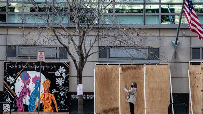 Shops are boarded up to protect against expected violence in Washington DC. Picture: Getty Images.