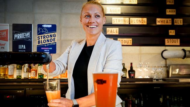 Erin Phillips perfectly pours her collaboration with Pirate Life – Strong Blonde – at The District at SkyCity. Picture: MIKE BURTON