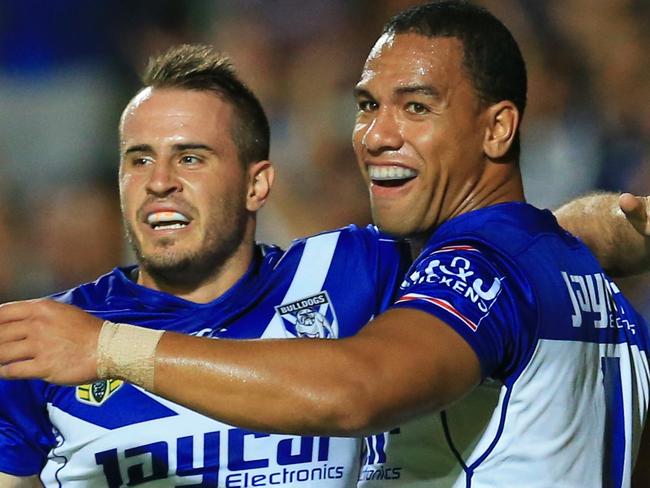 Will Hopoate of the Bulldogs celebrates his try with Josh Reynolds, left, during the Manly Sea Eagles v Canterbury Bulldogs NRL round 1 game at Brookvale Oval. pic Mark Evans