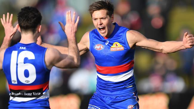 Fergus Greene celebrates kicking his first AFL goal on debut.